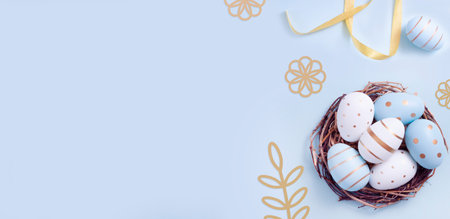 Easter egg and cake on blue table background. Happy Easter backdrop for spring holiday. Postcard...