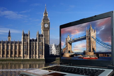 Big Ben with Tower Bridge on screen of notebook, London, UK の写真素材