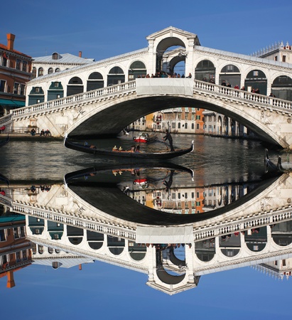 Venice, Rialto bridge with gondola in Italy の写真素材