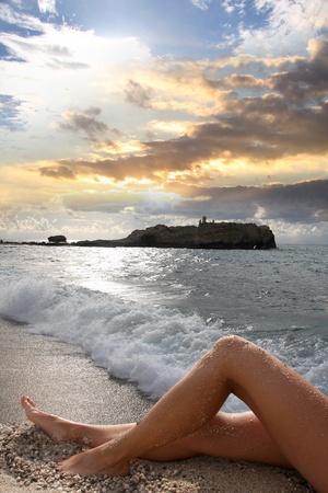 beautiful woman legs on the beach の写真素材