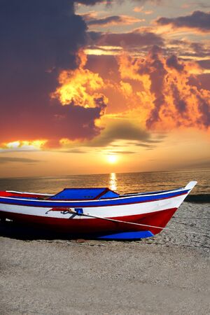 fishing boat against beautiful sunset の写真素材