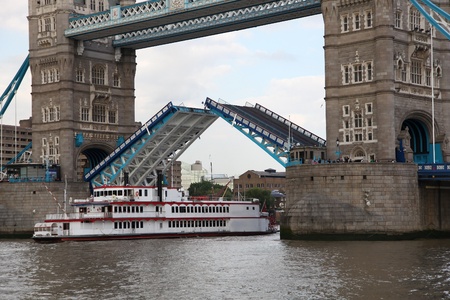 Famous Tower Bridge with city cruise in London, UKの写真素材