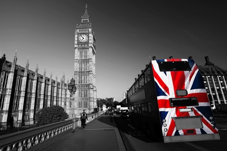Big Ben with city bus covered flag of England, London, UK の写真素材