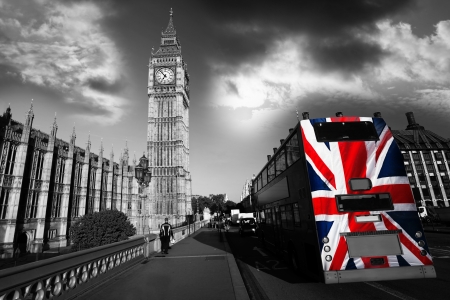 Big Ben with city bus covered flag of England, London, UK の写真素材