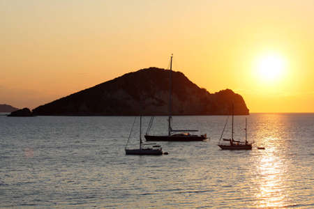 Yachts against sunset in Greece, Zakynthos Islandの写真素材