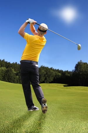 Man playing golfの写真素材
