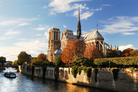 Notre Dame with boat on Seine in Paris, Franceの写真素材