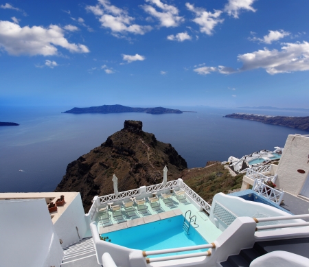 Luxury resort swimming pool in Santorini, Greeceの写真素材