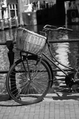 Bike against canal in Amsterdam,Netherlandsの写真素材