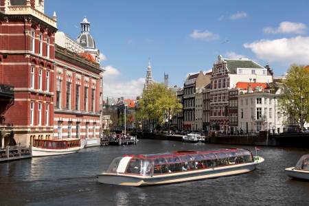 Amsterdam city with boat on canal in Hollandの写真素材