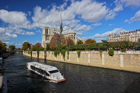 Notre Dame with boat on Seine in Paris, Franceのeditorial素材