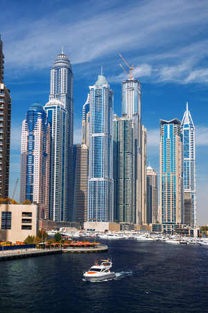 Dubai Marina with boat against skyscrapers in Dubai, United Arab Emirates          のeditorial素材