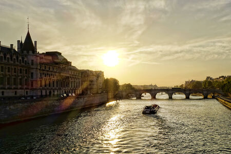 Sunset with boat on Seine in Paris, Franceの写真素材