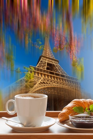 Coffee and croissants against Eiffel Tower in Paris, Franceの写真素材