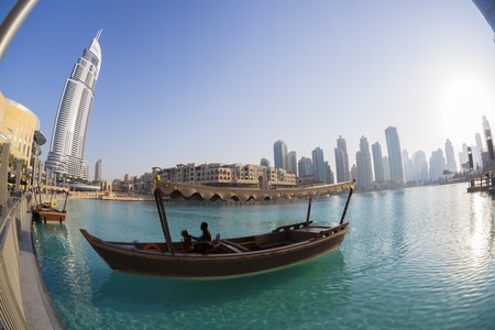 Dubai lagoon with boat against sunset in United Arab Emiratesの写真素材