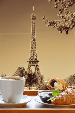 Coffee with croissants against Eiffel Tower in Paris, Franceの写真素材