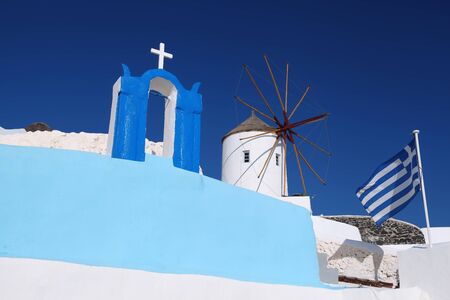 Santorini with famous windmill in Greece, Oia villageの写真素材