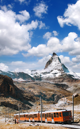 Famous Matterhorn peak with a train in Swiss Alps, Switzerlandの写真素材