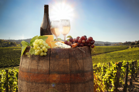 White wine with barrel on famous vineyard in Chianti, Tuscany, Italyの写真素材
