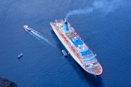 Santorini island with ship in Greeceの写真素材