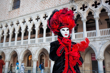 Carnival mask against Doge palace in Venice, Italyの写真素材
