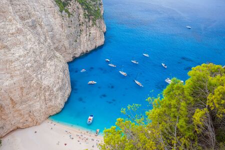Navagio beach with yachts on Zakynthos island in Greeceの写真素材