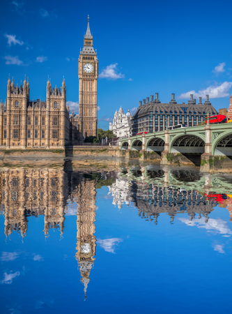 London with red buses against Big Ben in England, UKのeditorial素材