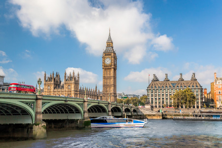 Big Ben and Houses of Parliament with boat in London, UK