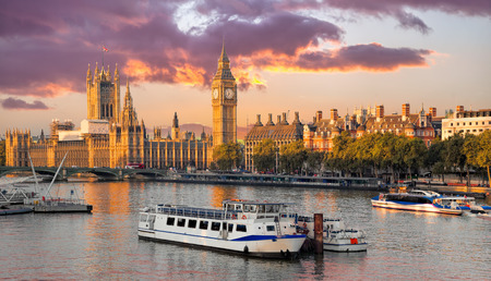 Big Ben and Houses of Parliament with boat in London, England, UK