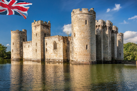 Historic Bodiam Castle with flag of England in East Sussex, United Kingdomのeditorial素材