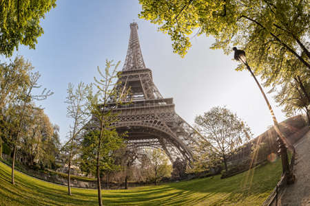 Eiffel Tower with spring trees against sunrise in Paris, Franceのeditorial素材