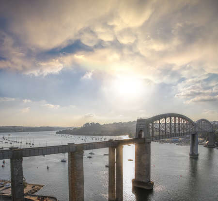 Royal Albert train Bridge designed by Isambard Kingdom Brunel against sunset in Plymouth, Devon,...