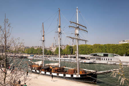 Old sailing ship moored on Seine river during spring time in Paris, Franceのeditorial素材