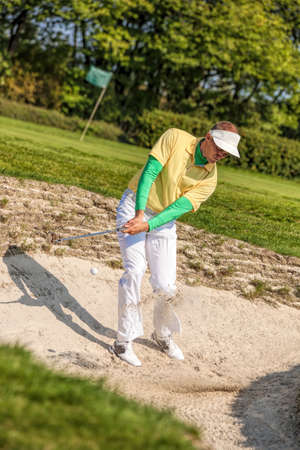Man playing golfの写真素材