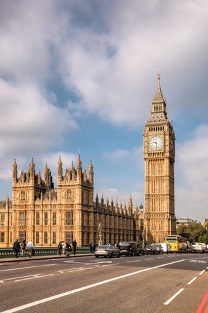 Big Ben during a sunny day with busy bridge in London, England, UKの写真素材