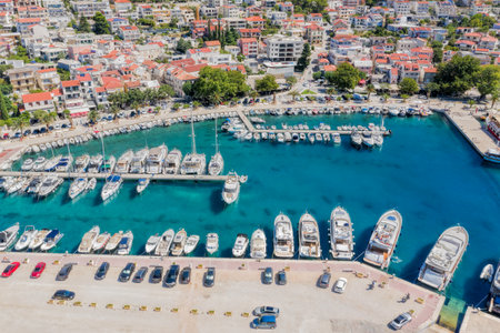 Aerial view of Baska Voda town with harbor in Makarska riviera, Dalmatia, Croatia