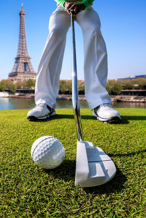 Olympic golf in Paris 2024 (man playing golf against Eiffel Tower in France)の写真素材