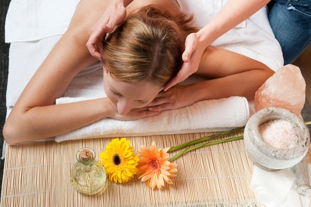 Girl having a massage in wellness centerの写真素材
