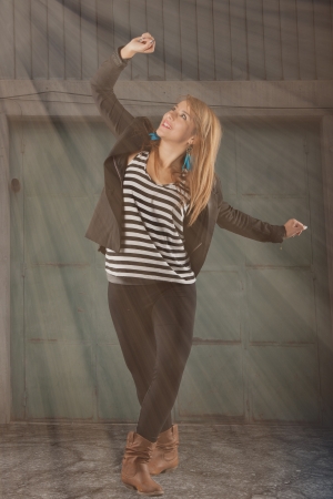 young dancer dancing under sun beams の写真素材