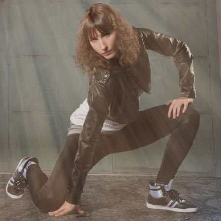 young dancer dancing under sun beams の写真素材