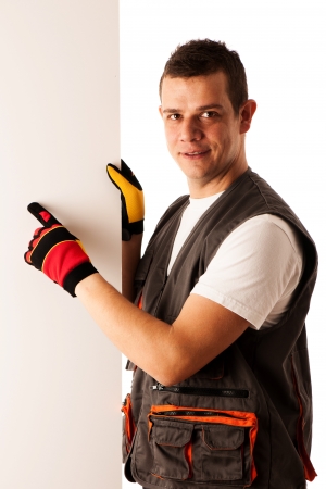 Worker points to blank boardの写真素材