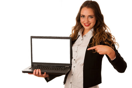 Attractive asian caucasian woman holding a laptop in her hands with blank space on monitor for adittional text isolated over white backgroundの写真素材