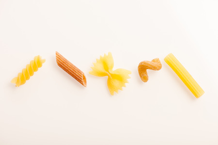 Asortment of five differen shape of pasta isolated over white.の写真素材