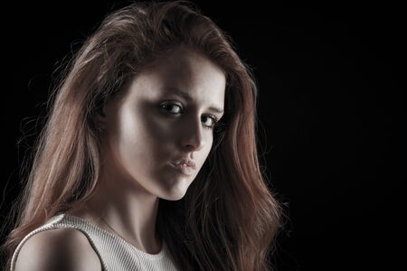 Dark beauty portrait of a young caucasian woman
