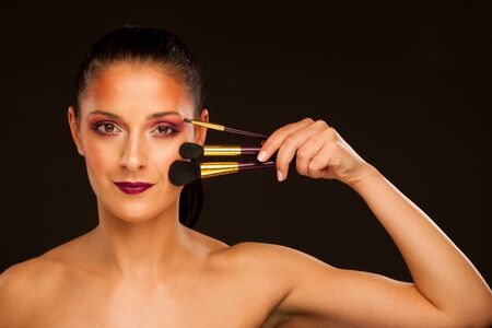 beauty portrait of young hispanic woman over black background