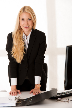 Young business woman offers hand when meeting new person or sign contreactの写真素材