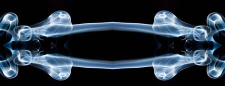 movement of smoke, Abstract Light blue smoke on black background, Light blue background,Light blue ink on black backgroundの写真素材