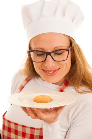 Woman chef serving a cookieの写真素材