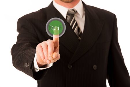 Happy young businessman in suit and tie presenting, promoting, advertising isolated over white.の写真素材