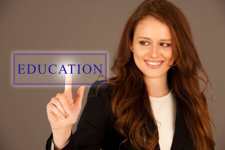 Attractive business woman pressing a virtual button